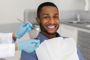 Man smiling during his teeth whitening appointment